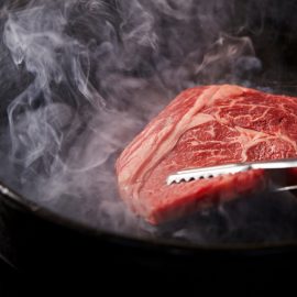 wagyu steak cooking in pan